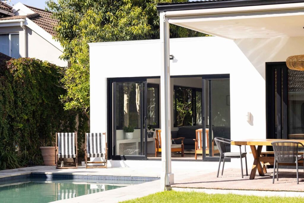 modern-backyard-with-pool-lounge-chairs-and-outdoo-M9YD478.jpg